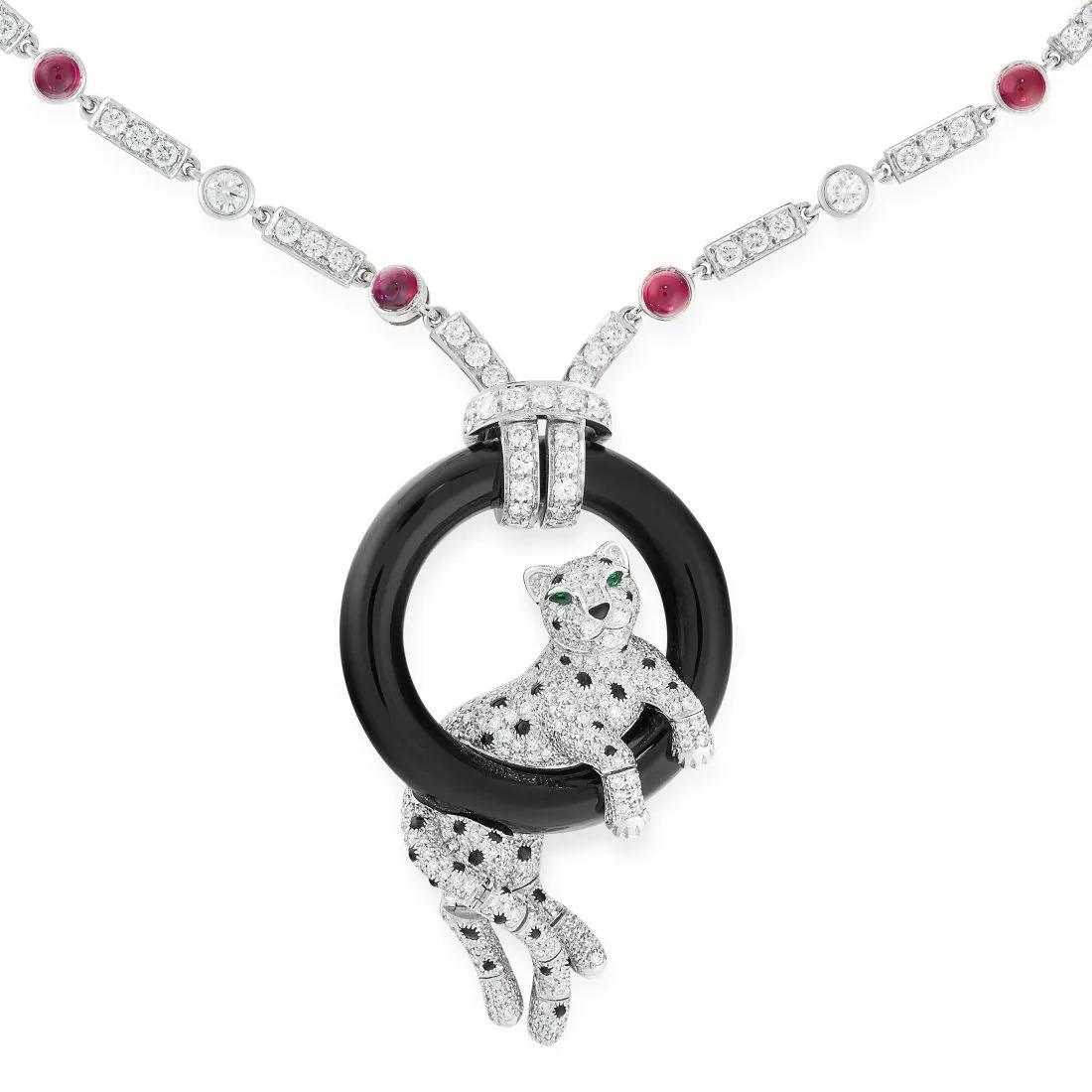 A RUBY, DIAMOND, EMERALD AND ONYX PANTHER PENDANT NECKLACE in platinum, the chain set with (1 of 2)