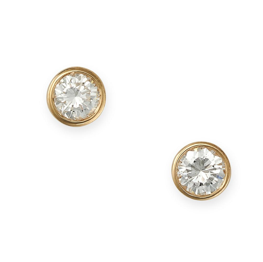 A PAIR OF DIAMOND STUD EARRINGS in yellow gold, set with round brilliant cut diamonds totalling 0.45: A PAIR OF DIAMOND STUD EARRINGS in yellow gold, set with round brilliant cut diamonds totalling 0.45 carats, stamped 750, 5.0mm, 1.1g.