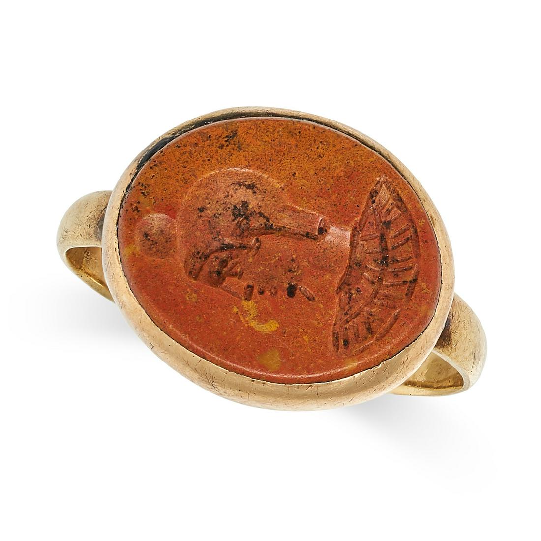 AN ANTIQUE HARDSTONE INTAGLIO RING in yellow gold, set with a brown hardstone carved to depict a the: AN ANTIQUE HARDSTONE INTAGLIO RING in yellow gold, set with a brown hardstone carved to depict a the profile of a man, no assay marks, size L1/2 / 6, 3.1g. 