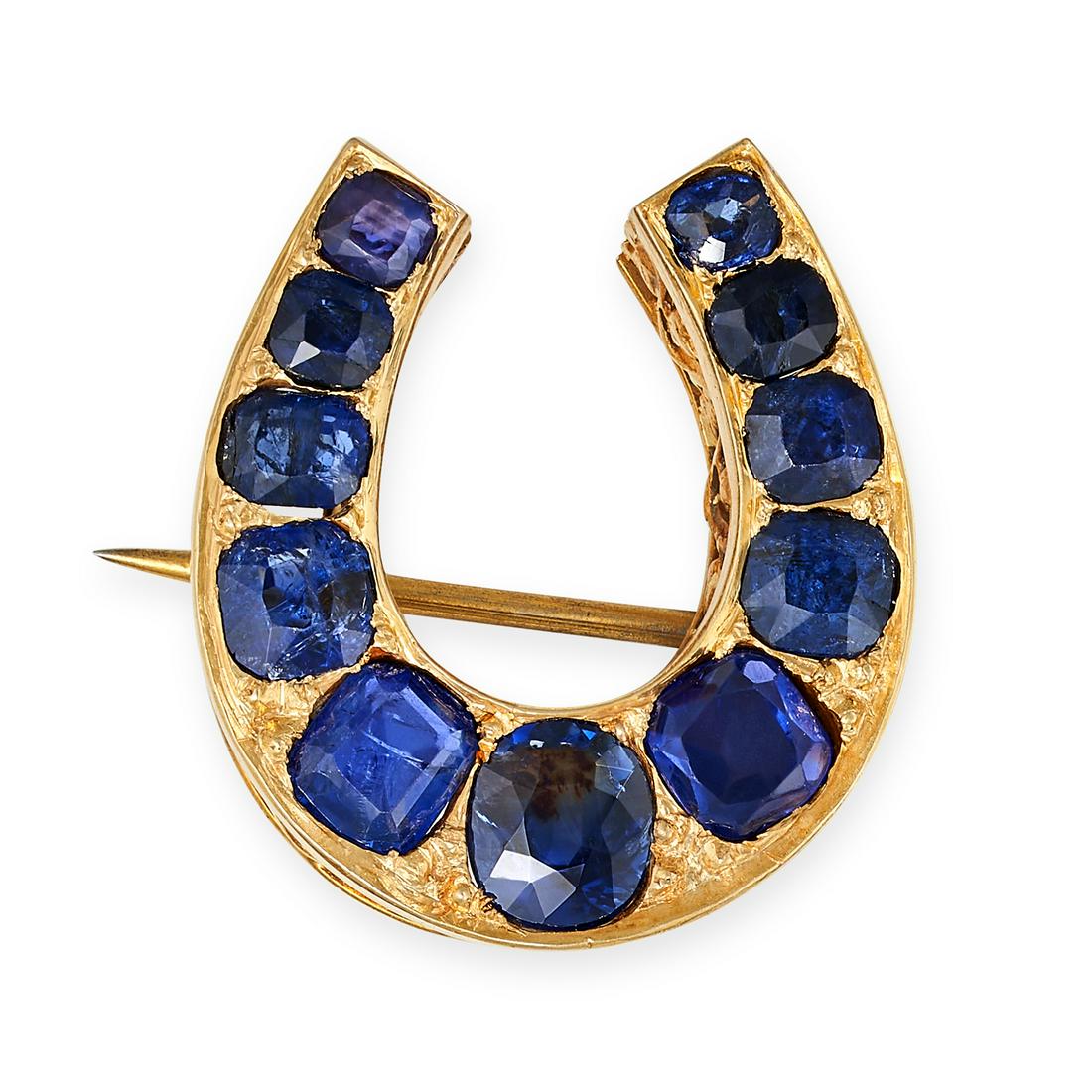 AN ANTIQUE SAPPHIRE HORSESHOE BROOCH, 19TH CENTURY in yellow gold, designed as a horseshoe set with (1 of 1)