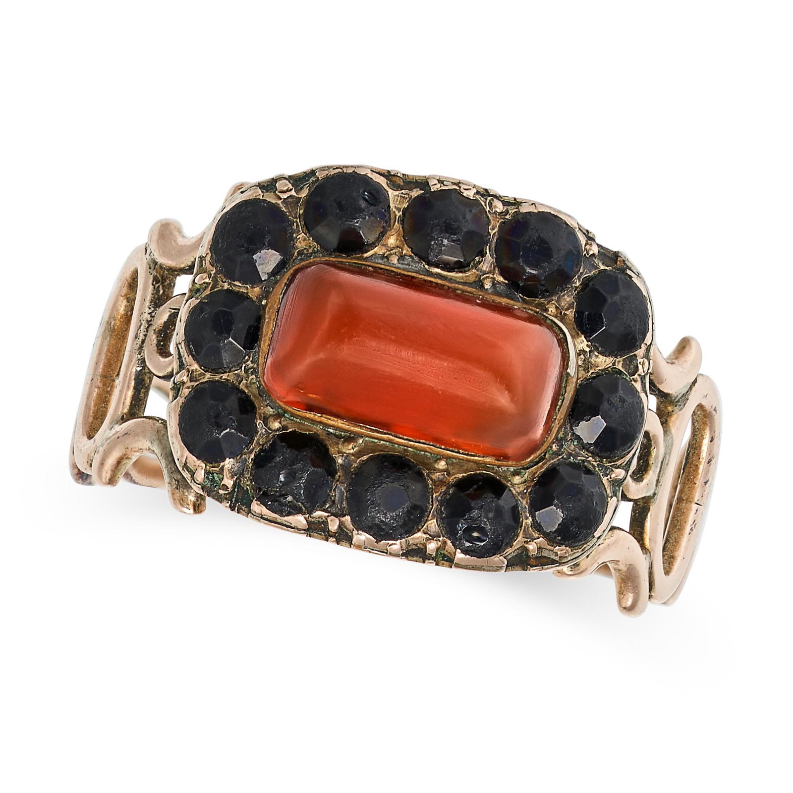 AN ANTIQUE GEORGIAN CARNELIAN AND JET RING in yellow gold, set with a cabochon carnelian in a border: AN ANTIQUE GEORGIAN CARNELIAN AND JET RING in yellow gold, set with a cabochon carnelian in a border of faceted jet, no assay marks, size P / 7.75, 3.2g. 