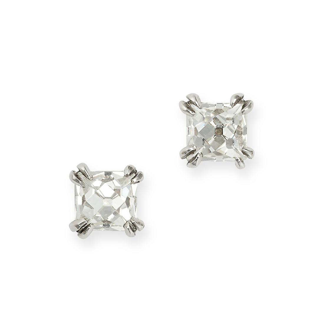 A PAIR OF DIAMOND STUD EARRINGS in platinum, each set with a French cut diamond, both diamonds (1 of 1)
