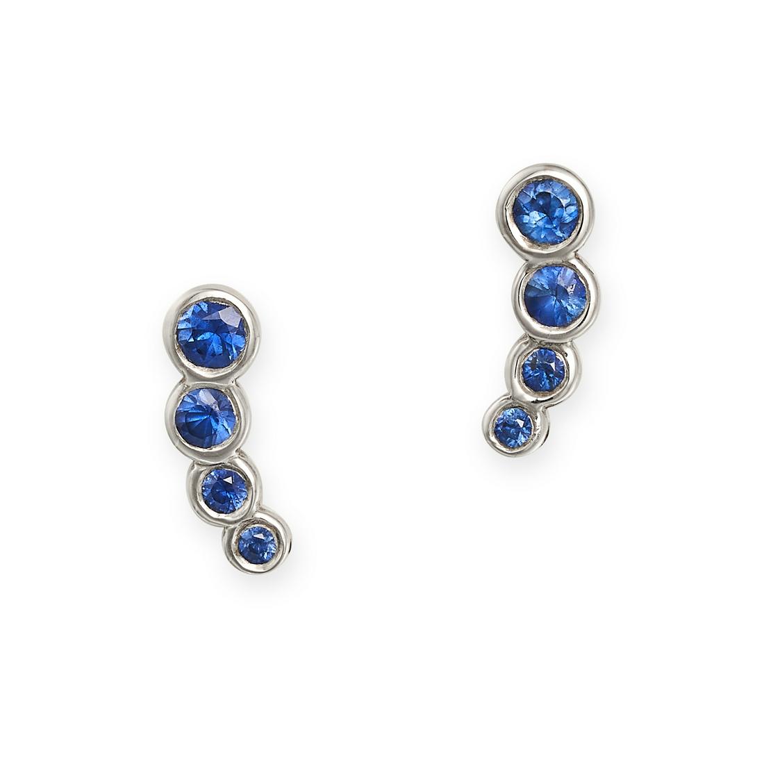 A PAIR OF SAPPHIRE STUD EARRINGS in 18ct white gold, each set with four graduated round cut (1 of 1)
