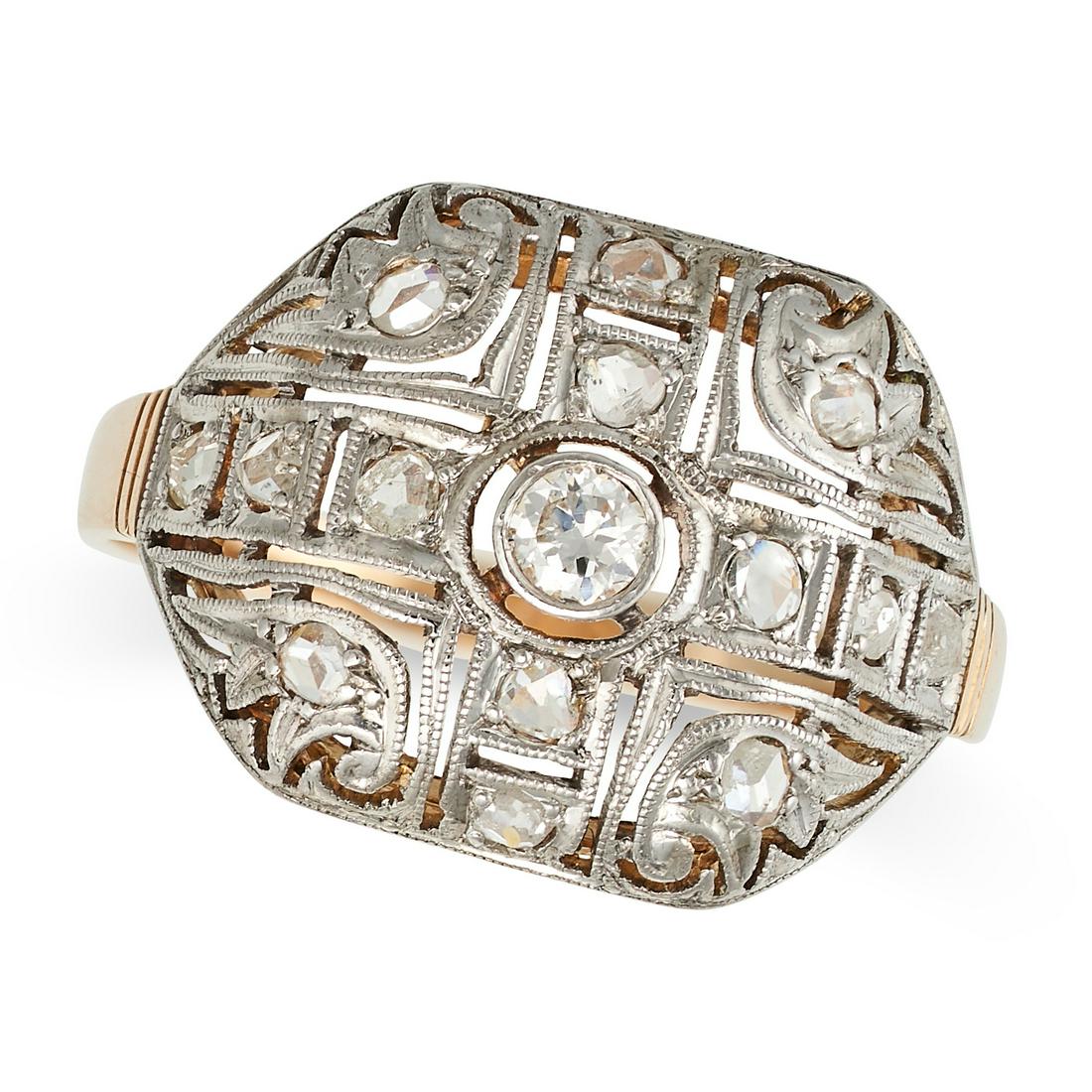 A DIAMOND DRESS RING in yellow gold and platinum, the openwork face set with old and rose cut: A DIAMOND DRESS RING in yellow gold and platinum, the openwork face set with old and rose cut diamonds, no assay marks, size O / 7.25, 3.0g.