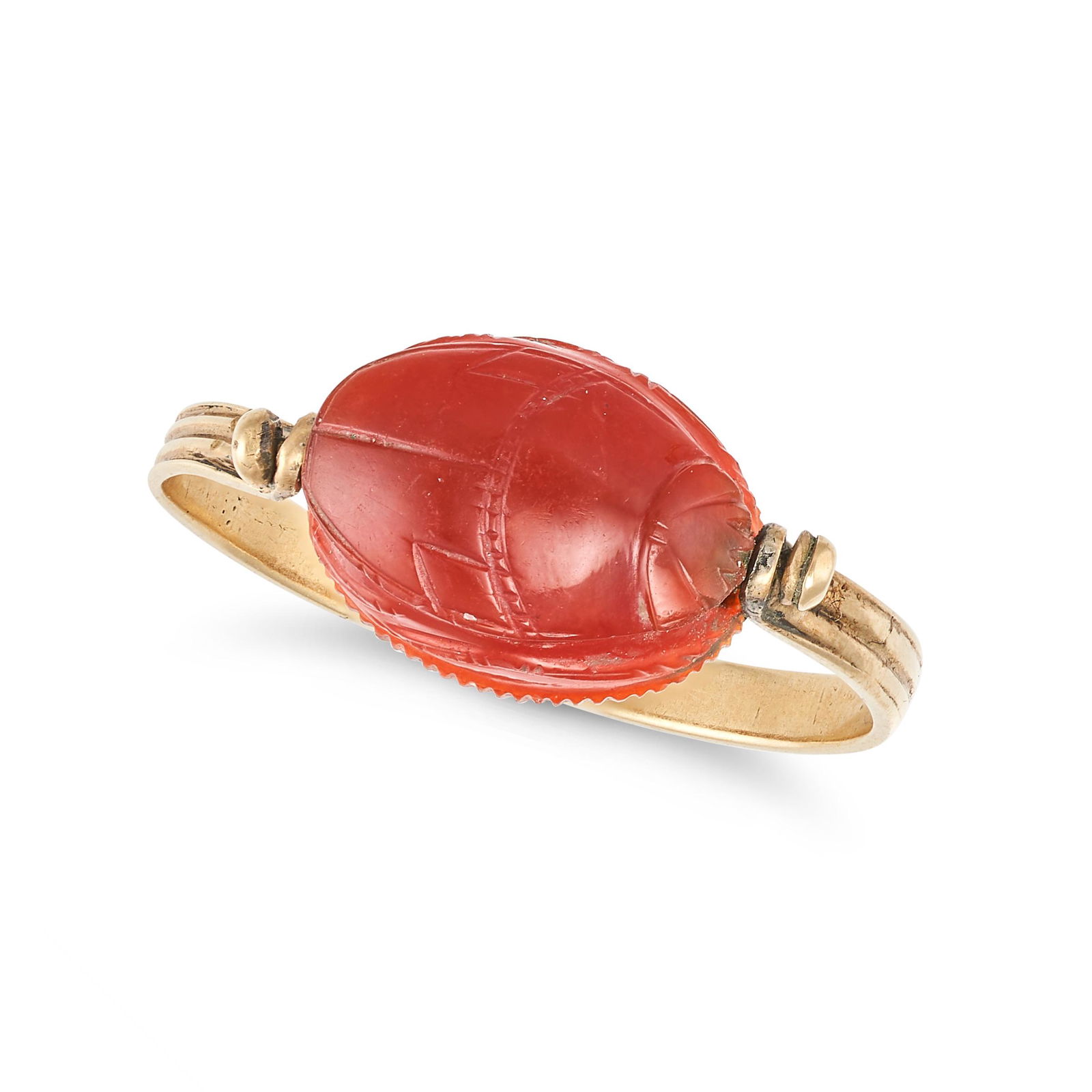 AN ANTIQUE CARNELIAN SCARAB BEETLE SWIVEL RING in yellow gold, set with an articulated carved (1 of 2)