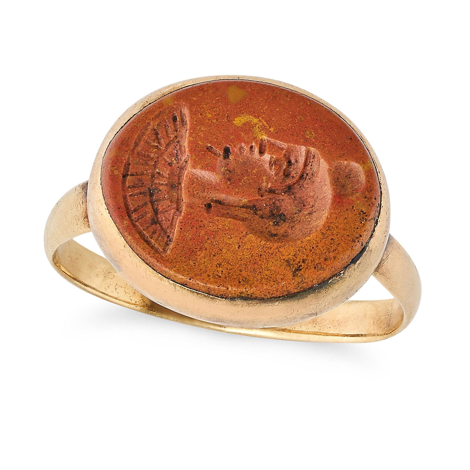 AN ANTIQUE HARDSTONE INTAGLIO RING in yellow gold, set with an orange hardstone intaglio carved to (1 of 2)