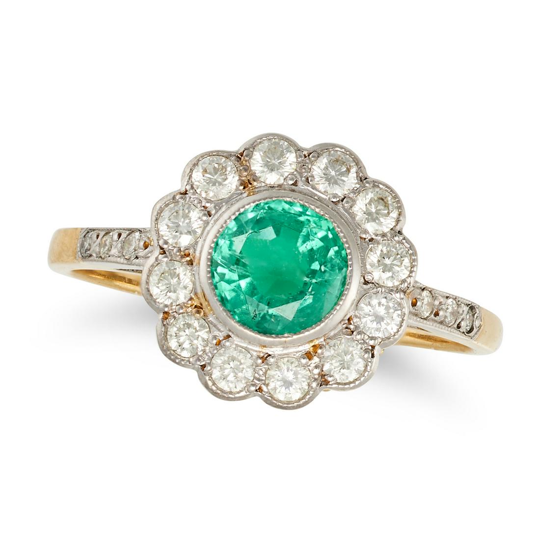 AN EMERALD AND DIAMOND CLUSTER RING in yellow and white gold, set with a round cut emerald in a (1 of 1)