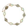 AN ARTS AND CRAFTS OPAL AND DEMANTOID GARNET BRACELET set with alternating oval cabochon opals and