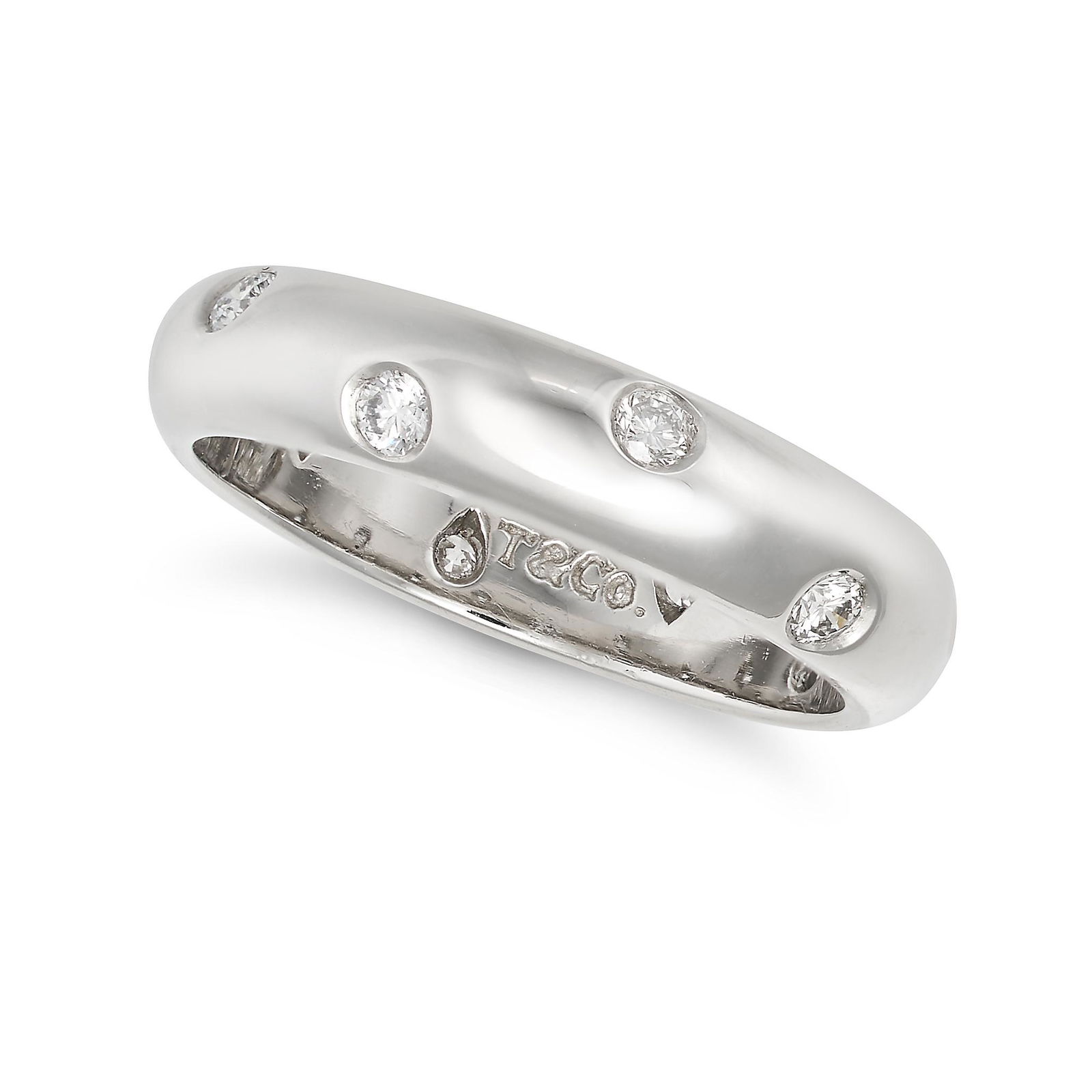 TIFFANY & CO., A DIAMOND ETOILE RING in platinum, the band set with staggered round brilliant (1 of 1)
