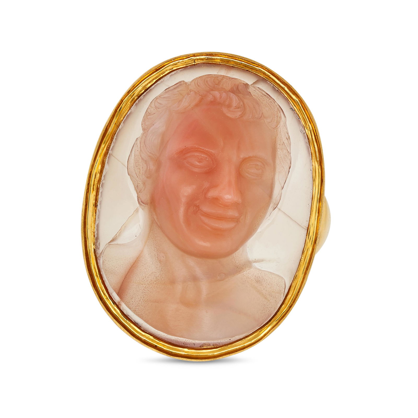 AN ANTIQUE CARNELIAN CAMEO RING in yellow gold, set with an oval carnelian cameo carved to depict: AN ANTIQUE CARNELIAN CAMEO RING in yellow gold, set with an oval carnelian cameo carved to depict the bust of a classical man, no assay marks, size N1/2 / 7, 12.1g. 