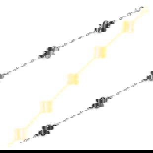 VAN CLEEF & ARPELS, A TIGER'S EYE ALHAMBRA BRACELET in 18ct yellow gold, comprising five quatrefoil: VAN CLEEF & ARPELS, A TIGER'S EYE ALHAMBRA BRACELET in 18ct yellow gold, comprising five quatrefoil links set with tiger's eye, connected by lengths of chain, signed VCA and numbered, French assay mar