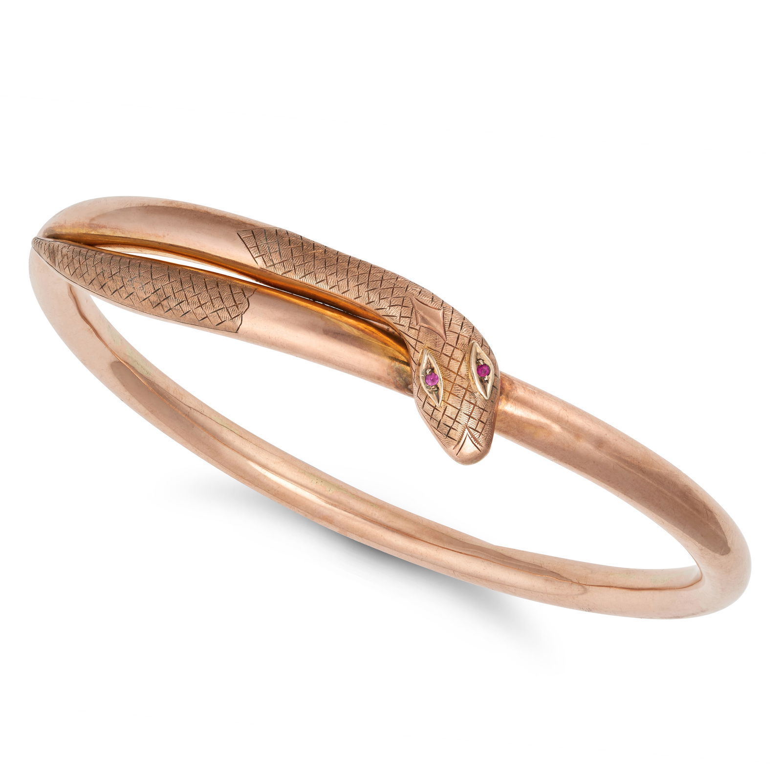 A LARGE ANTIQUE RUBY SNAKE BANGLE in 9ct yellow gold, designed as a coiled snake, the eyes set with (1 of 1)