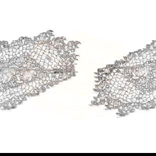 BUCCELLATI, AN IMPORTANT AND EARLY DIAMOND BROOCH, 1930s in platinum, set with a principal old: BUCCELLATI, AN IMPORTANT AND EARLY DIAMOND BROOCH, 1930s in platinum, set with a principal old European cut diamond of approximately 1.10 carats, the openwork lattice body set throughout with old and