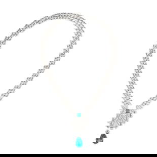 A COLOMBIAN EMERALD AND DIAMOND NECKLACE in 18ct white gold, comprising five articulated rows of: A COLOMBIAN EMERALD AND DIAMOND NECKLACE in 18ct white gold, comprising five articulated rows of round brilliant cut diamonds, suspending a geometric pendant set with a square step cut emerald and sin