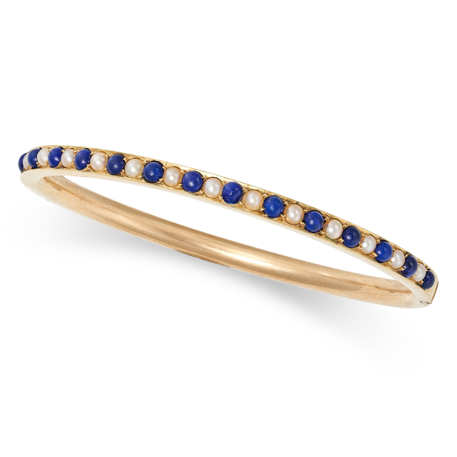 AN ANTIQUE LAPIS LAZULI AND PEARL BANGLE in 14ct yellow gold, the hinged bangle set with a row of (1 of 1)