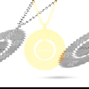GUCCI, A LOGO NECKLACE in 18ct yellow gold, comprising a medallion engraved with the double G Gucci: GUCCI, A LOGO NECKLACE in 18ct yellow gold, comprising a medallion engraved with the double G Gucci logo and the word 'GUCCI', suspended from a trace chain, stamped 750, pendant 2.9cm, chain 42.5cm, 1