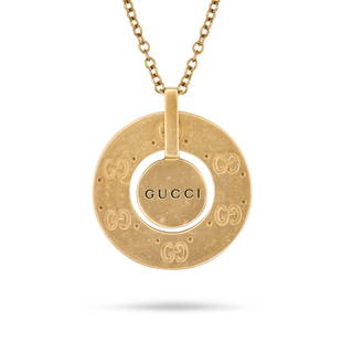 GUCCI, A LOGO NECKLACE in 18ct yellow gold, comprising a medallion engraved with the double G Gucci: GUCCI, A LOGO NECKLACE in 18ct yellow gold, comprising a medallion engraved with the double G Gucci logo and the word 'GUCCI', suspended from a trace chain, stamped 750, pendant 2.9cm, chain 42.5cm,