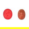 A MOULDED GLASS INTAGLIO AND A CARVED SCARAB BEETLE the red glass intaglio moulded to depict Cupid