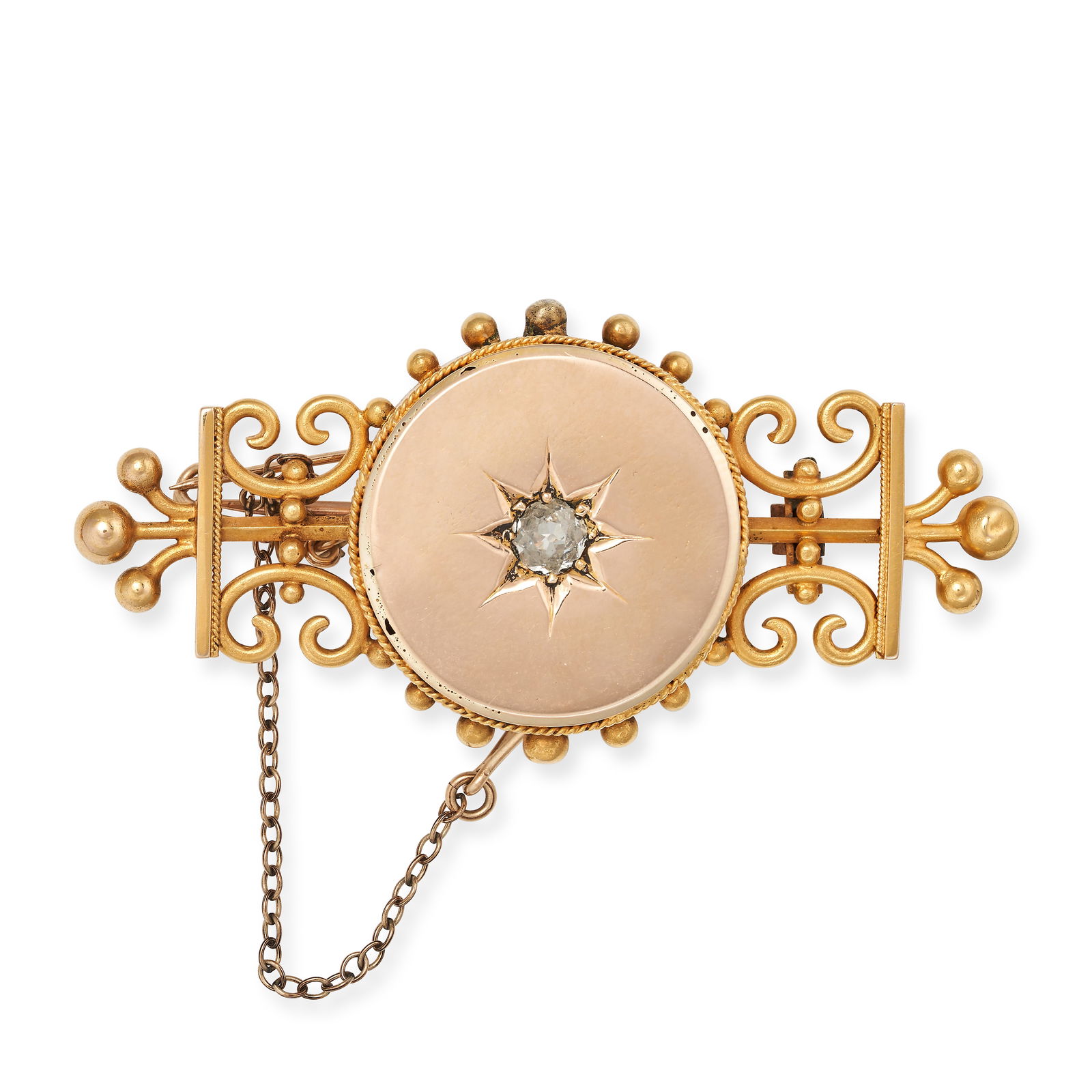 AN ANTIQUE DIAMOND LOCKET BROOCH in yellow gold, set with an old cut diamond in an engraved star (1 of 1)