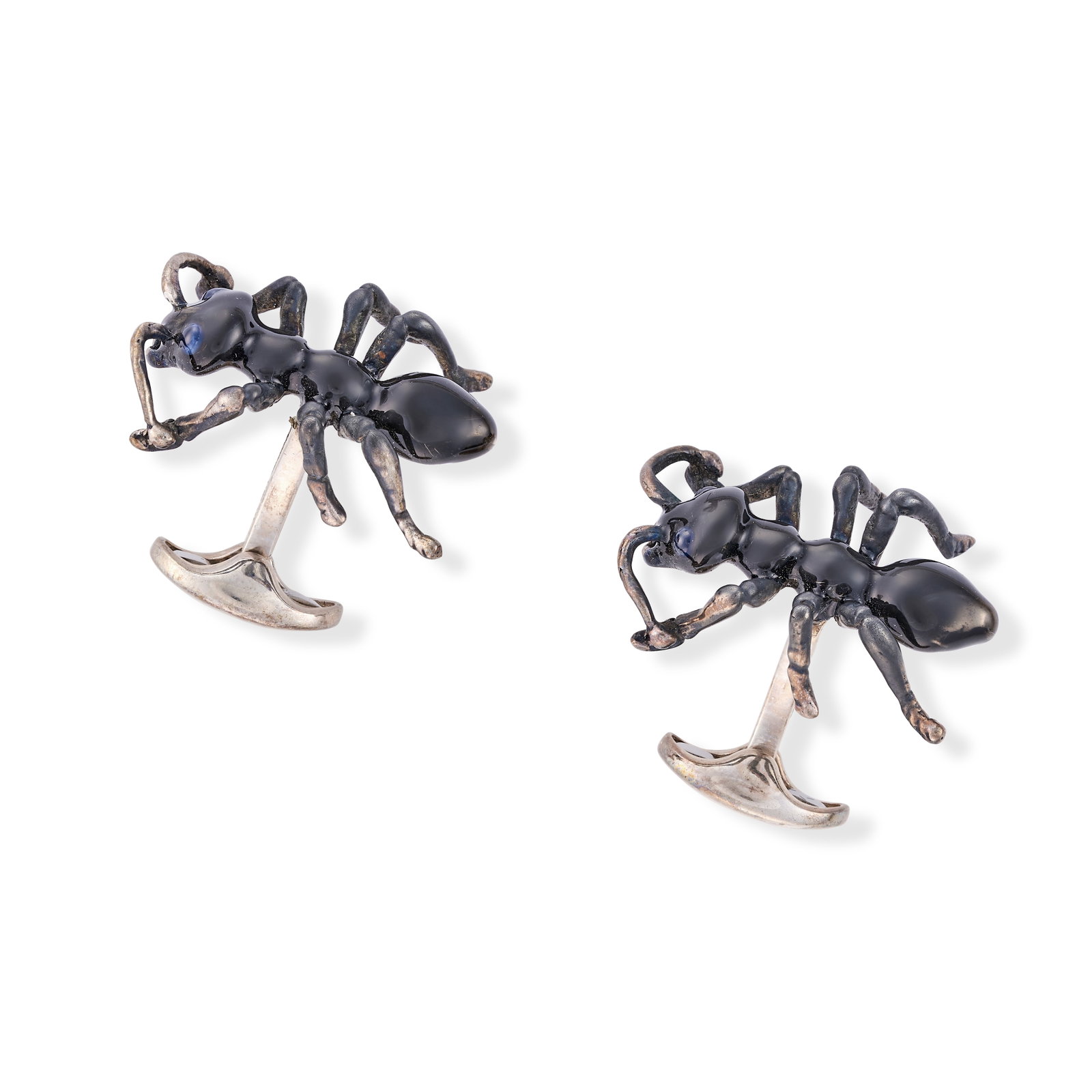 NO RESERVE - DEAKIN AND FRANCIS, A PAIR OF ENAMEL AND SAPPHIRE ANT CUFFLINKS in silver, each: NO RESERVE - DEAKIN AND FRANCIS, A PAIR OF ENAMEL AND SAPPHIRE ANT CUFFLINKS in silver, each designed as an ant relieved in dark grey enamel, the eyes set with round cabochon sapphires, signed Deakin 