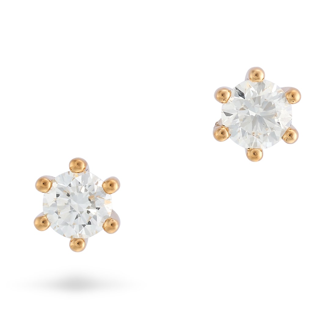 BUCHERER, A PAIR OF DIAMOND STUD EARRINGS in 18ct yellow gold, each set with a round brilliant cu...: BUCHERER, A PAIR OF DIAMOND STUD EARRINGS in 18ct yellow gold, each set with a round brilliant cut diamond of approximately 0.20 carats, CB maker's mark, Swiss assay marks, 0.4cm, 1.1g. Accompanied by