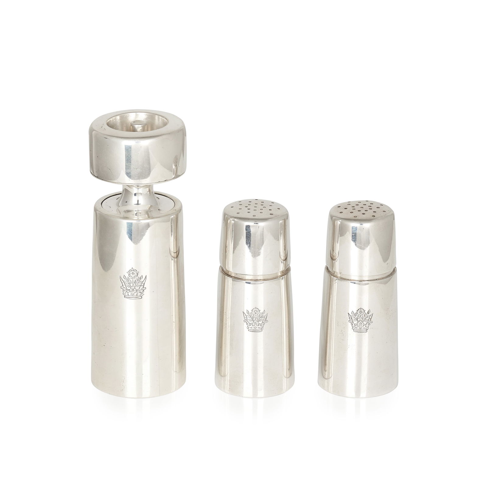 AN ELIZABETH II MODERNIST STERLING SILVER CRUET SET, GERALD BENNEY, LONDON 1965-1966 comprising t...: AN ELIZABETH II MODERNIST STERLING SILVER CRUET SET, GERALD BENNEY, LONDON 1965-1966 comprising two salt shakers and a pepper grinder, the tapering cylindrical bodies with engraved crests to the front