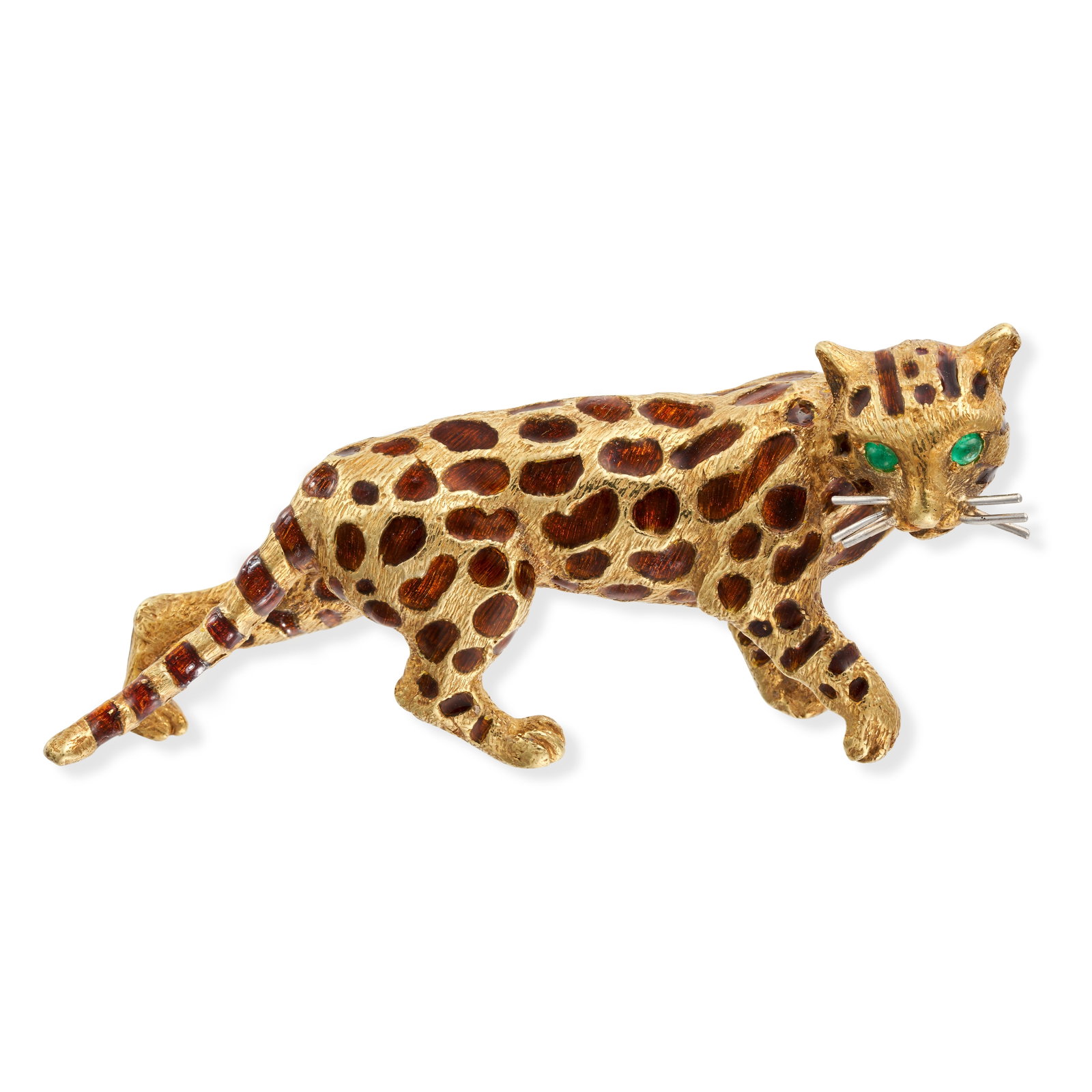 TIFFANY & CO., AN EMERALD AND ENAMEL CHEETAH BROOCH designed as a cheetah, the spots relieved in ...: TIFFANY & CO., AN EMERALD AND ENAMEL CHEETAH BROOCH designed as a cheetah, the spots relieved in brown enamel, the eyes set with round cabochon emeralds, signed Tiffany, stamped 18K, 5.4cm, 19.9g.