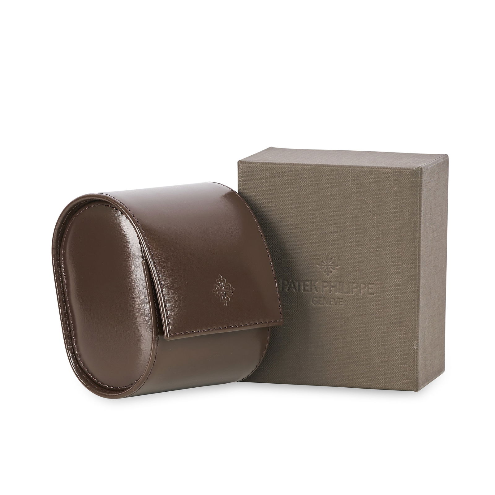 PATEK PHILIPPE - A WATCH TRAVEL CASE FOR ONE PC, in brown leather with suede inner fabric and: PATEK PHILIPPE - A WATCH TRAVEL CASE FOR ONE PC, in brown leather with suede inner fabric and cushion, approximate size 9.5 x 7.8 x 6.5cm, with outer packaging.