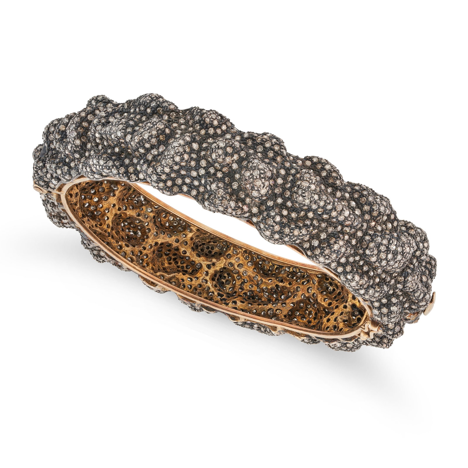 A DIAMOND BANGLE the stylised hinged bangle set throughout with round cut diamonds, the diamonds: A DIAMOND BANGLE the stylised hinged bangle set throughout with round cut diamonds, the diamonds totalling 16.64 carats, no assay marks, inner circumference 18.0cm, 48.1g.