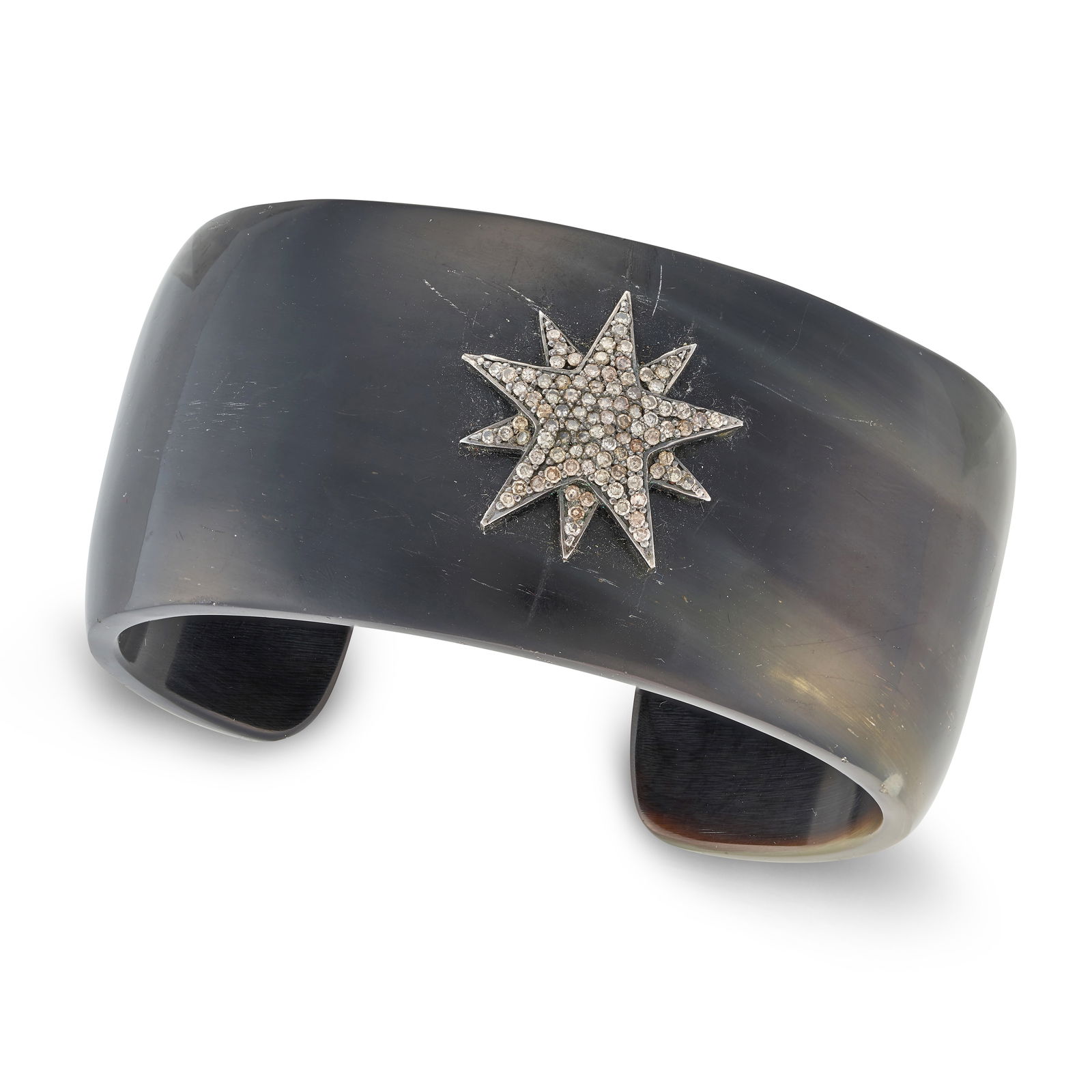 A DIAMOND STAR BANGLE the open cuff bangle with an applied star motif set with single cut diamonds, (1 of 1)
