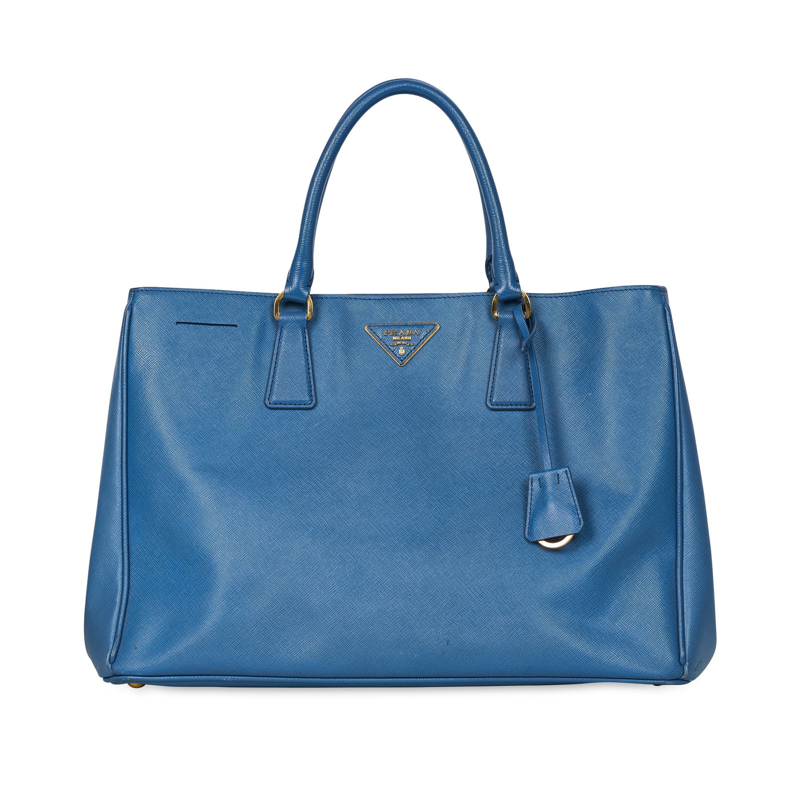 PRADA BLUE SAFFIANO LEATHER TOTE BAG Condition grade B-. Blue Saffiano leather exterior with: PRADA BLUE SAFFIANO LEATHER TOTE BAG Condition grade B-. Blue Saffiano leather exterior with double leather top handles, four protective metal feet at base and a Prada logo plaque at front. Interior i