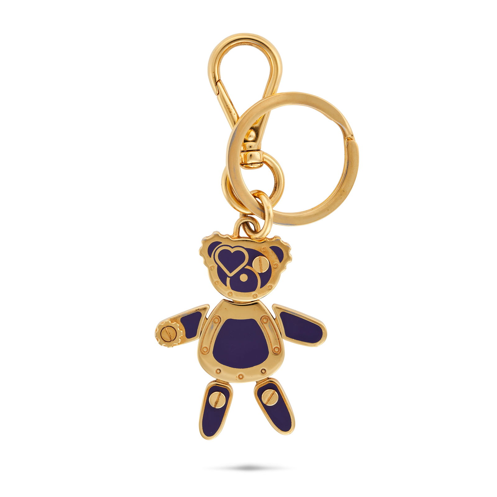 PRADA PURPLE ENAMEL TEDDY BEAR KEYCHAIN Gold tone metal key chain in the shape of a teddy bear: PRADA PURPLE ENAMEL TEDDY BEAR KEYCHAIN Gold tone metal key chain in the shape of a teddy bear with flexible arms and legs, accented with purple enamel with an engraved Prada logo at the back. Length