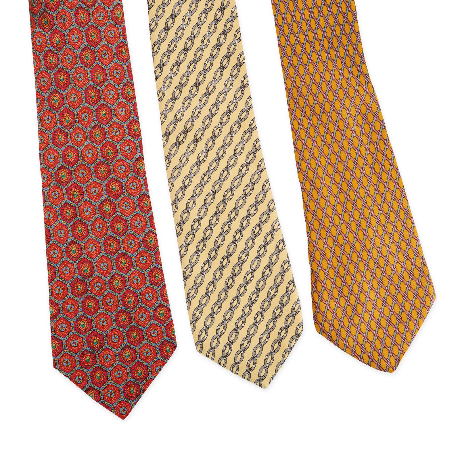 THREE HERMÈS TIES Condition grade B+. Hermès Silk Tie. Yellow background with grey buckle: THREE HERMÈS TIES Condition grade B+. Hermès Silk Tie. Yellow background with grey buckle print. 100% silk. Made in France. Dimensions 143cm x 8cm. Hermès Silk Tie. Red, blue and yellow abstract pr