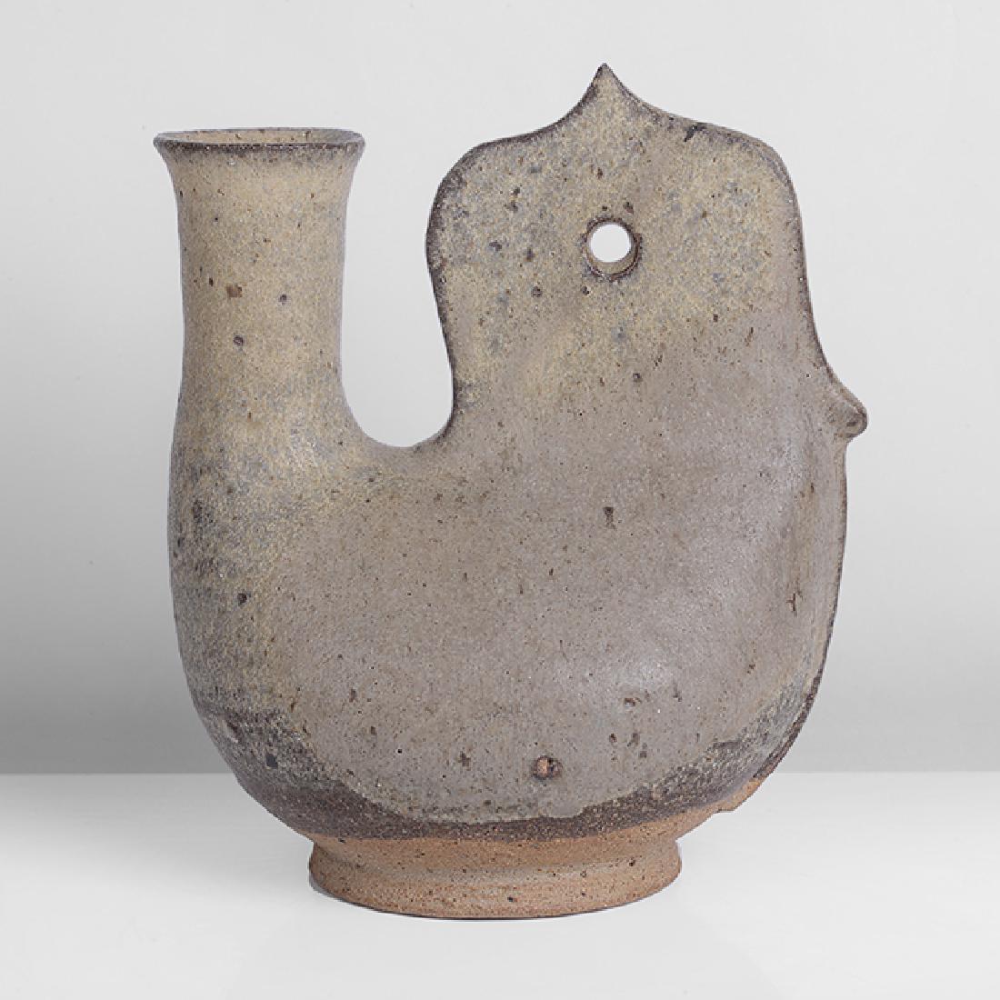 Ian Godfrey (British, 1942-1992): Early 'Pilgrim' Flask, circa 1970 Stoneware, mottled grey green over iron glazes with iron speckle, the flask form mounted with a pierced carved handle H 18.0Ccm, W 15.7cm, D 10.6cm