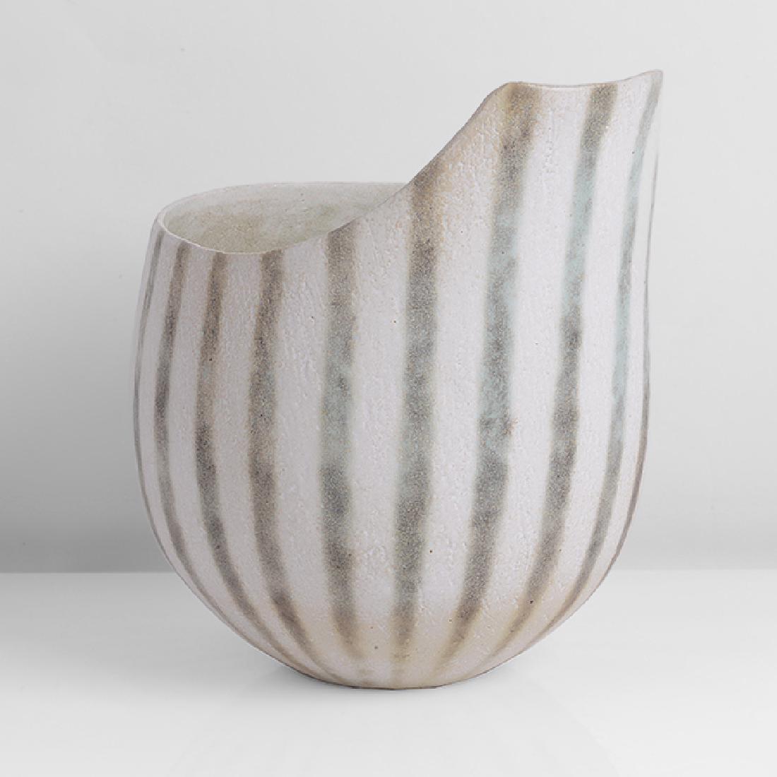 John Ward (British, b.1938): Bowl with extended Rim, circa 1995 Stoneware, matt white and green glazes, the vertical linear design running from the extended rim and tapering to the base, mottled white and green interior, impresse
