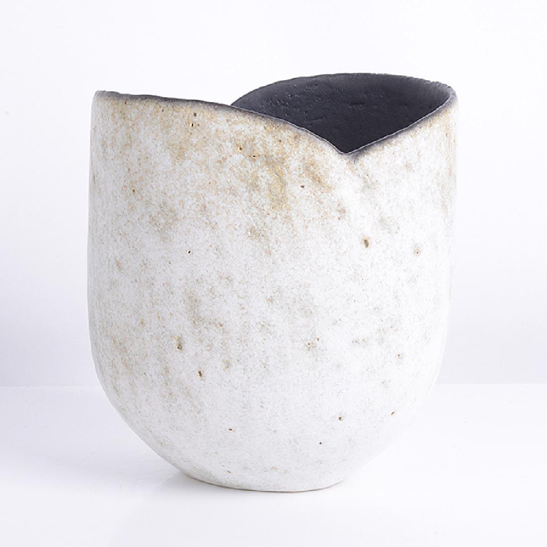 John Ward (British, 1938) Small Pot, circa 1990: John Ward (British, 1938) Small Pot, circa 1990 Stoneware, mottled white and green glaze with black interior, a curved impressed line running over the shoulder following the lines of the cut rim, impr