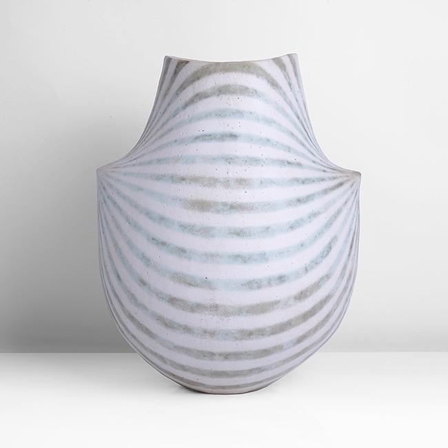John Ward (British, b.1938) Monumental Shouldered: Stoneware, matt white softly pitted glaze with arching green and brown mottled bands radiating from the two pointed shoulders, rising to a tapering neck with a gently dipped rim, the interior with cre
