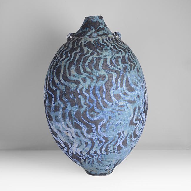 Peter Beard (British, b.1951) Tall Vessel with Lugs,: Stoneware, mottled green, blue and white undulating bands on a black softly textured ground, of tall ovoid form with tapering rim and foot, the collar mounted with two small looping lugs, impressed PF