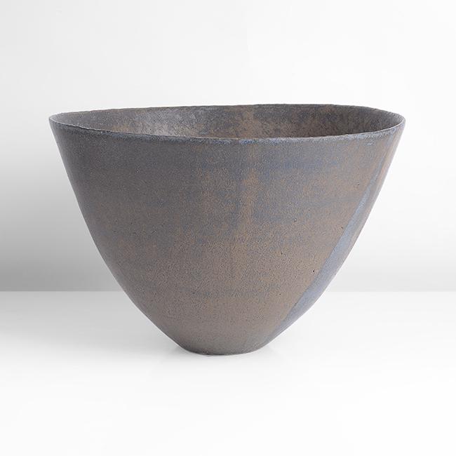 John Ward (British, b.1938): Large Dark Bowl, circa 1990 Stoneware, dark black and brown glazes over a textured surface with blue splashes, impressed JW seal H 22.0cm, D 33.0cm PROVENANCE: Private Collection, London