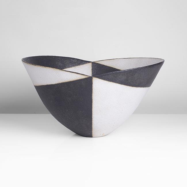 John Ward (British, b.1938): Wide Bowl with Cut Rim, circa 1995 Stoneware, matt black and white glazes in alternating bands accentuating the lines of the V cut rim, soft cream bleed where the two colours meet, impressed JW seal H