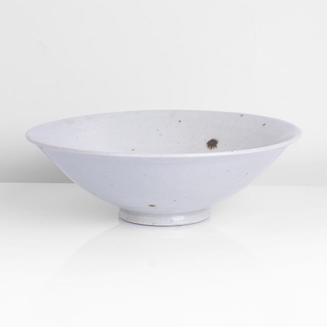 Bernard Leach (British, 1887-1979): Small Open Bowl, 1965 Porcelain, pale celadon glaze with iron speckle, a delicate spiral in the well, impressed BL and Leach Pottery seals Size H 5.4cm, D 17.0cm Notes PROVENANCE: Private Collection,