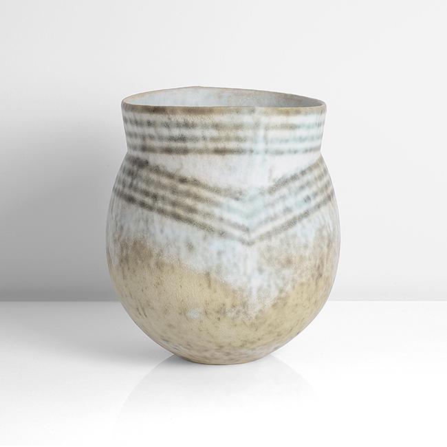 John Ward (British, b. 1938): Vessel with Flared Collar, circa 1995 Stoneware, mottled glazes in dark cream, white and green, with linear bands running around the collar accentuating the vertical impressions front and back, impres