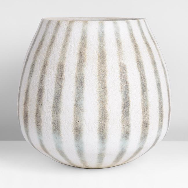 John Ward (British, 1938): Enclosed Vessel, circa 1990 Stoneware, matt white glaze over a textured surface with mottled green and brown vertical bands, the interior mottled white and green, impressed J