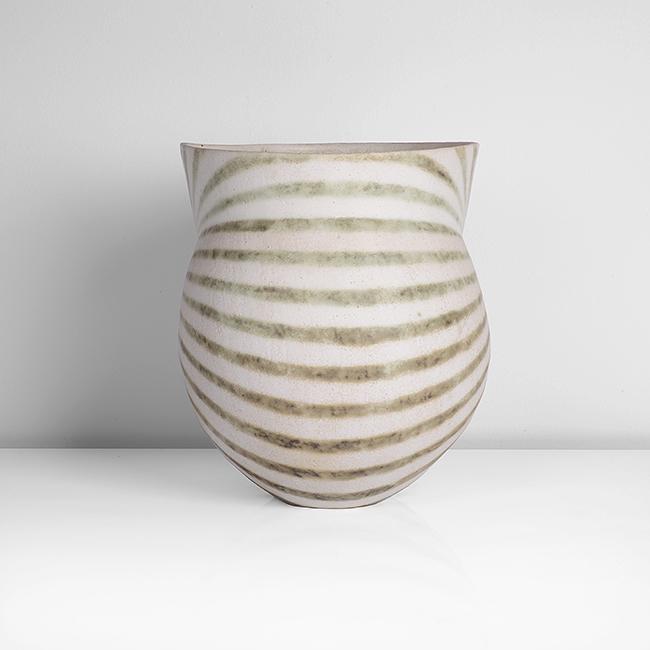 John Ward (British, b.1938): Vessel with Flared Collar, circa 1995 Stoneware, matt white glaze with mottled green bands, the rounded body with vertical impressions front and back, the flared collar extending to a sharp edge, the