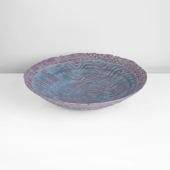 Peter Beard (British, b.1951): Large Open Bowl, circa 1990 Stoneware, mottled pink and blue glazes with turquoise blue wave pattern in the rim, impressed PFB seal H 9.6cm, D 40.2cm PROVENANCE: The Chestnut Gallery Collection. Acqui