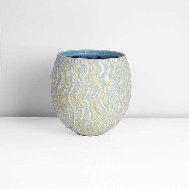 Peter Beard (British, b.1951): Vessel, circa 2000 Stoneware, undulating bands in alternating yellow, green and blue glazes with red flashes, the interior with running blue and turquoise glazes, impressed PFB and maker's marks H 18.