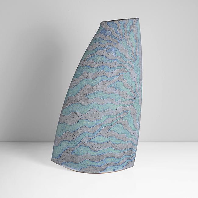 Peter Beard (British, b.1951): Rocking Vessel', 2003 Stoneware, undulating bands of mottled blue and green with contrasting blue grey glazes, the flattened form with curved base, impressed PFB and maker's marks H 42.5cm, W 24.4cm,