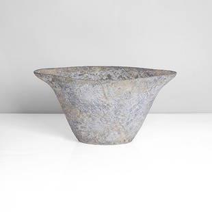 Paul Philp (British, b.1941): Curved Vessel', 2015 Stoneware, roughly textured surface with dry pale blue, deep blue, cream and ochre mottled glazes, painted signature H 16.0cm, W 32.1cm, D 15.6cm PROVENANCE: Private Collection, L