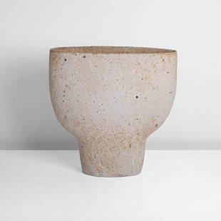 Paul Philp (British, b.1941): Flattened Vessel Stoneware with mineral inclusions, textured surface beneath dry cream and brown mottled glazes, impressed maker's mark H 32.4cm, W 32.0cm, D 12.3cm CONDITION: Perfect condition with n