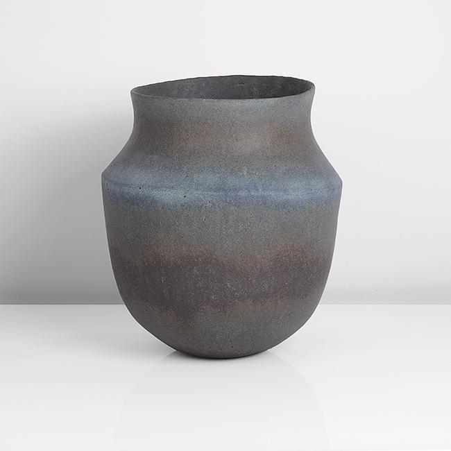 John Ward (British, b. 1938): Shouldered Vessel, circa 1990 Stoneware, mottled blue, green, black and brown glazes to a textured surface, the rounded form inverted at the shoulder, impressed JW seal DIMENSIONS: H 25.9cm, D 21.4cm